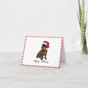 Chiot de Daschund dans la carte de Noël de