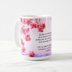 Christliche Tasse mit Schriften und Kirschblüte
