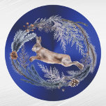 Christmas Blue Rabbit Floral Watercolor Runder Aufkleber<br><div class="desc">Kaninchen springen in einen Blumenkranz.</div>