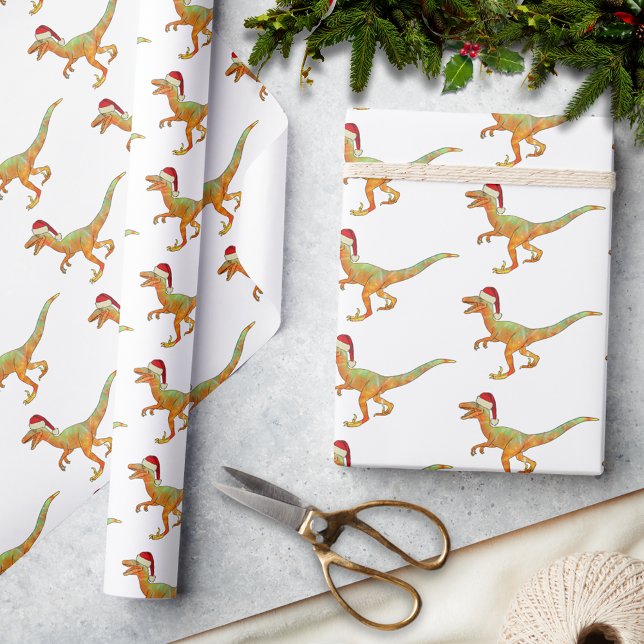 Christmas Dinosaur Raptor Geschenkpapier (Christmas dinosaur velociraptor wearing a santa hat pattern holiday wrapping paper festive raptor )