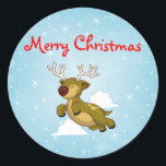 Christmas Flying Rentier Runder Aufkleber<br><div class="desc">Ein niedliches Cartoon-Bild eines bezaubernden Weihnachtsrentiers,  der mit Schneeflocken und Wolken im Hintergrund in den Himmel fliegt.</div>
