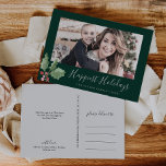 Christmas Greenery Happiest Holidays Family Photo Feiertagspostkarte<br><div class="desc">This Christmas greenery happiest holidays family photo postcard makes the perfect simple holiday greeting. The winter holiday design features soft sage green watercolor holly branch with sprigs of classic red holly berries. Add your family picture and personalize the postcard with your family name,  year,  personal greeting,  and names.</div>