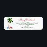 Christmas Palm Tree Lights Tropical Island Beach<br><div class="desc">Palme mit Weihnachtsbaumleuchten, und Geschenke darunter. Ein lustiges tropisches Strand- oder Inselthema, als Weihnachtsdesign in den Ferienfarben Rot und Grün. Frohe Weihnachten ist geschrieben als Gruß oder Wechsel zu Happy Holidays oder irgendeine kurze Formulierung. Personalisieren Sie einfach mit Ihrem Familiennamen und Ihrer Adresse oder einer beliebigen Formulierung bis zu 4...</div>