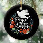 Christmas Peace on Earth Script Keramik Ornament<br><div class="desc">A pretty Christmas ornament featuring a dove in a floral wreath with the words Peace on Earth. The Christmas ornament is designed in black,  red and white. An elegant holiday ornament for your Christmas tree. Designed for you by Blackberry Boulevard.</div>