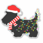 Christmas Scottie Dog mit Licht Aufkleber<br><div class="desc">Schottische Hundeliebhaber von Terrier werden diesen festlichen,  schwarzen Scottie Dog mit einer Weihnachtsmannmütze,  rot-weiß gestreiften Schal und bunten Saitenleuchten genießen! Erleben Sie Weihnachten mit diesem lustigen Design auf individuellen Aufklebern!</div>