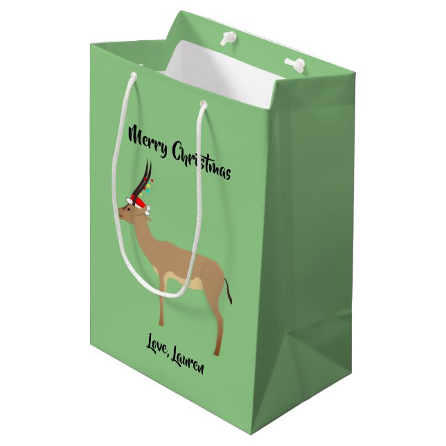 Christmas Springbok Mittlere Geschenktüte (Vorderseite Schrägansicht)