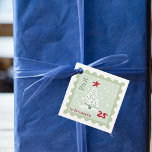 Christmas Tree Postage Briefmarke Monogram Name Sq Geschenkanhänger<br><div class="desc">Dieses Design kann in dem Bereich personalisiert werden, der durch das Ändern des Fotos und/oder Textes zur Verfügung gestellt wird. Sie können auch angepasst werden, indem Sie auf Vorlage personalisieren klicken und dann auf die Schaltfläche klicken, um weitere Optionen anzupassen, um die Hintergrundfarbe zu löschen oder zu ändern, Text hinzuzufügen,...</div>