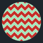 Christmas Zigzag Runder Aufkleber<br><div class="desc">Dieses gewagte geometrische Muster besteht aus abwechselnden roten und minzgrünen Zickzacken, die durch feine, weiße Ränder getrennt sind. Das rote und grüne Design ist ein stilvolles Weihnachtsbild. Digitales Bild. Copyright © 2013 Claire E. Skinner. Alle Rechte vorbehalten.</div>