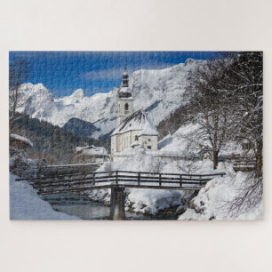 Church in the snow with Alps mountains