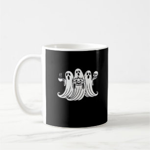 Citrouille tenant une tasse de café effrayant