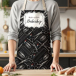 Classic Barbershop Tools Vintage Style Schürze<br><div class="desc">A bold, classic barbershop design featuring illustrated grooming tools like scissors, razors, clippers, and combs arranged in a striking vintage composition. The deep charcoal background with subtle metallic tones creates a strong, masculine aesthetic inspired by traditional barber culture. An elegant ornamental label frame in the center keeps the layout clean...</div>