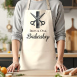 Classic Barbershop Tools Vintage Style Schürze<br><div class="desc">A bold, classic barbershop design featuring illustrated grooming tools like scissors, razors, clippers, and combs arranged in a striking vintage composition. The deep charcoal background with subtle metallic tones creates a strong, masculine aesthetic inspired by traditional barber culture. An elegant ornamental label frame in the center keeps the layout clean...</div>