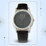 Classic Laurel Wreath Black Gold Monogram Armbanduhr<br><div class="desc">Ein klassisches Lorbeerkranz-Design in Schwarz und Gold,  das einen perfekten Mix aus Charme und Eleganz bietet. Das Monogramm fügt eine besondere Touch hinzu. Ideal als personalisiertes Geschenk für Familie und Freunde</div>