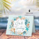 Coastal SEAS & GREETINGS Seahorse Shells Feiertagskarte<br><div class="desc">Coastal, beach or tropical Christmas holiday card featuring the greeting SEAS AND GREETINGS in modern handwritten script typography and watercolor seahorses, starfish, shells and ornaments in turquoise, teal, golden brown and white accented with faux glitter and your custom message inside. OPTIONS: The sample is shown on the 4x5.6" satin card--5x7...</div>