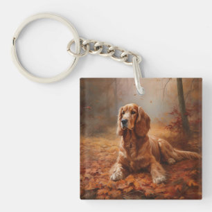 Cocker Spaniel dans les feuilles d'automne qui tom