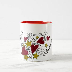 Coeurs et tasse de heureuse Sainte-Valentin