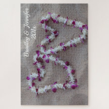 Coeurs hawaïens dans le puzzle de sable