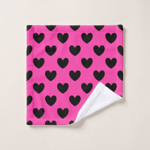 Coeurs polka noirs sur rose fuchsia