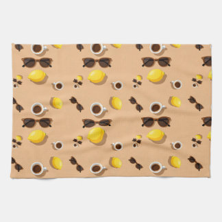 Coffee lemons and sunglasses on a warm sand geschirrtuch