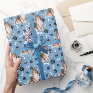 Collie Dog Paw Print Pattern auf blau Geschenkpapier