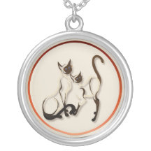 Collier de deux chats siamois