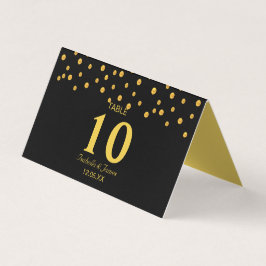 Confetti d'or sur carte de table de pliage noir