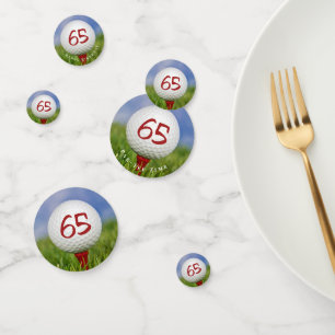 Confettis Boule de golf 65e anniversaire sur tee rouge