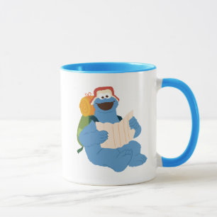 Cookie Monster liest eine Karte Tasse
