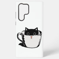 Chaton noir avec nez rouge caché dans une tasse