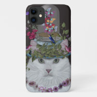 Chat blanc avec cloche papillon