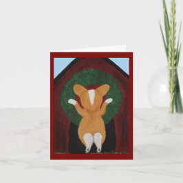 Corgi hängt Weihnachtskranz an das Hundehaus Karte