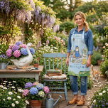 Cottage Garden Spring Watercolor Cute Cat Apron Schürze<br><div class="desc">Cottage Garden Spring Watercolor Cute Cat Apron This light blue apron features a charming watercolor illustration of a sweet cat dressed in a cobalt blue polka-dot headscarf, matching apron, and gardening gloves. The scene is filled with cottage garden details including hydrangeas, roses, butterflies, a friendly goose, potted flowers, a watering...</div>