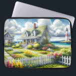 Cottage With View Of The Lighthouse Laptopschutzhülle<br><div class="desc">A dreamy coastal cottagecore landscape filled with soft watercolor charm and breezy seaside tranquility. A welcoming seaside cottage sits among lush garden paths, blooming flowers, and a bright white picket fence, creating a warm storybook atmosphere. In the distance, a tall lighthouse rises beside sparkling blue ocean waves, adding a classic...</div>