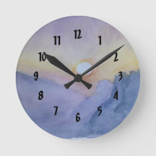 Coucher de soleil entre montagnes Horloge murale a