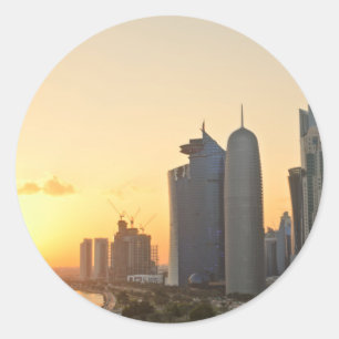 Coucher de soleil sur Doha, Qatar rond autocollant