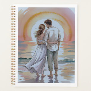 Couple sur la plage au coucher du soleil