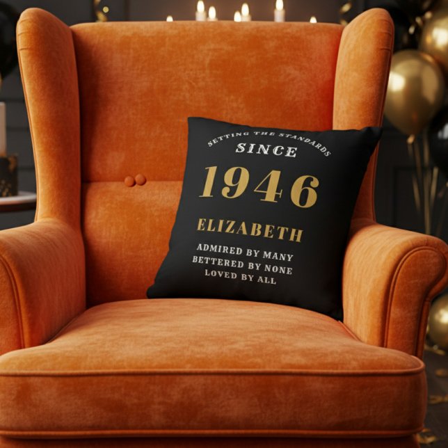 Coussin 80th Birthday Gift Personalized 1946 Black Gold (A vibrant orange velvet wingback armchair with a black throw pillow for an 80th birthday celebration)