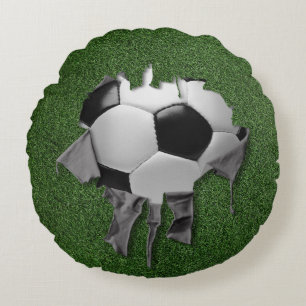 Coussin blanc rond de football déchiré