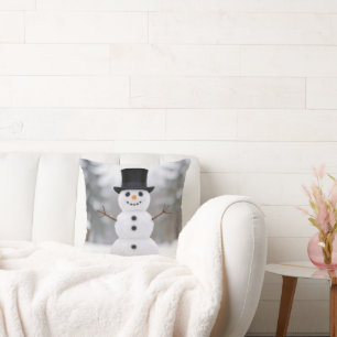 Coussin Bonhomme de neige heureux portant un chapeau haut