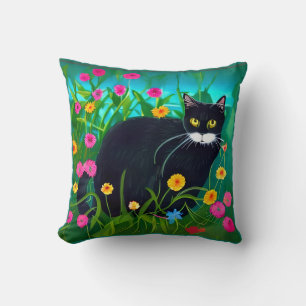 Coussin Chat noir dans un jardin fleuri coloré