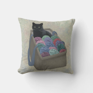 Coussin Chat noir dans un sac de laine