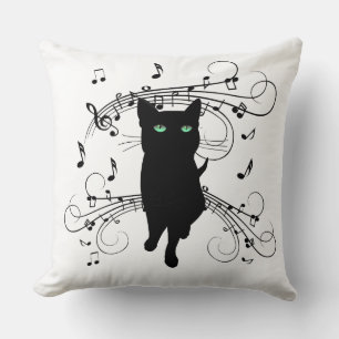 Coussin Chat noir entouré de notes de musique chuchotantes