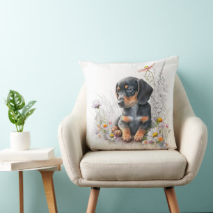 COUSSIN CHIOT DE SAINDOUX NOIR ET FEU AVEC FLEURS SAUVAGES