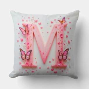 Coussin Conception de lettre M rose avec papillons