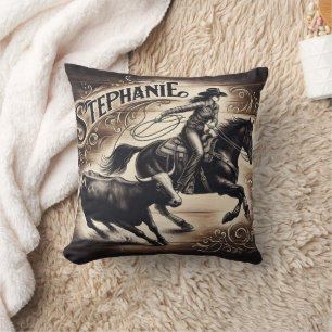 Coussin Cowgirl Roping Cattle à un événement de rodéo