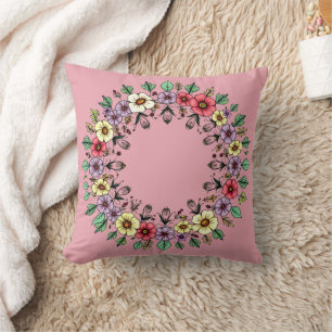 Coussin de jetée à couronne florale rose