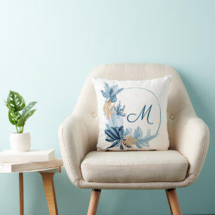Coussin de monogramme de fleurs d'or bleu
