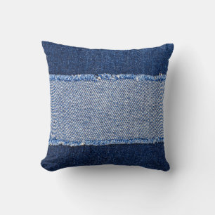 Coussin Dénim déchiré : tissu de jean bleu.