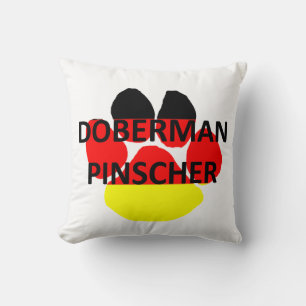 Coussin doberman pinscher sur la patte du drapeau allemand