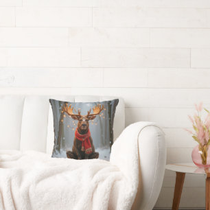 Coussin Élan de Noël portant une écharpe et des lumières